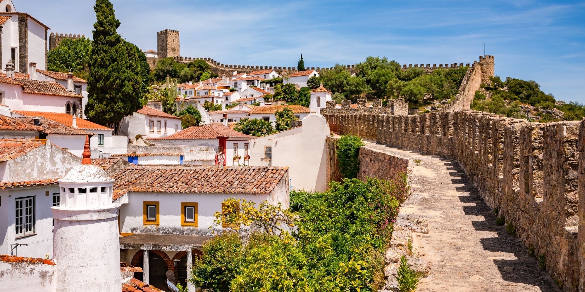 Visit the medieval town of Óbidos on Portugals Silver Coast famous for its historic architecture charming streets cultural events and timeless Portuguese characterjpg